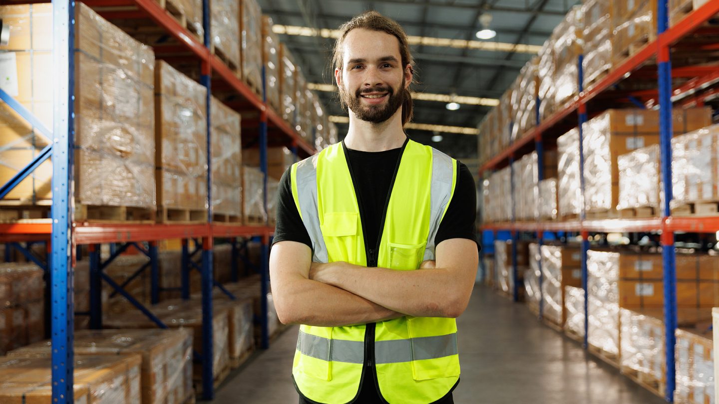 Soft Skills vs Hard Skills: Your Personal Traits are an Invaluable Asset 1 A warehouse worker in a hi vis safety vest