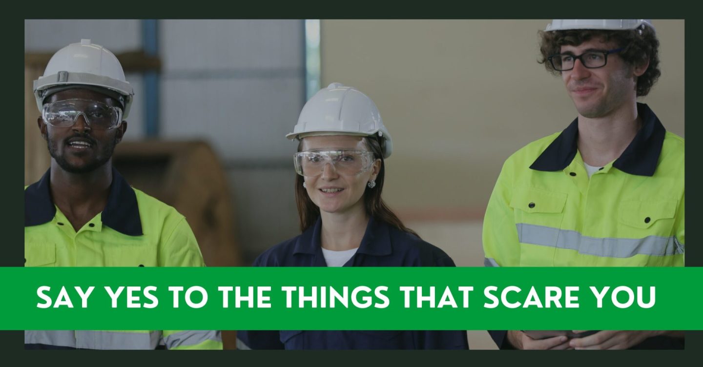 two men in hi vis vests standing next to a woman wearing PPE