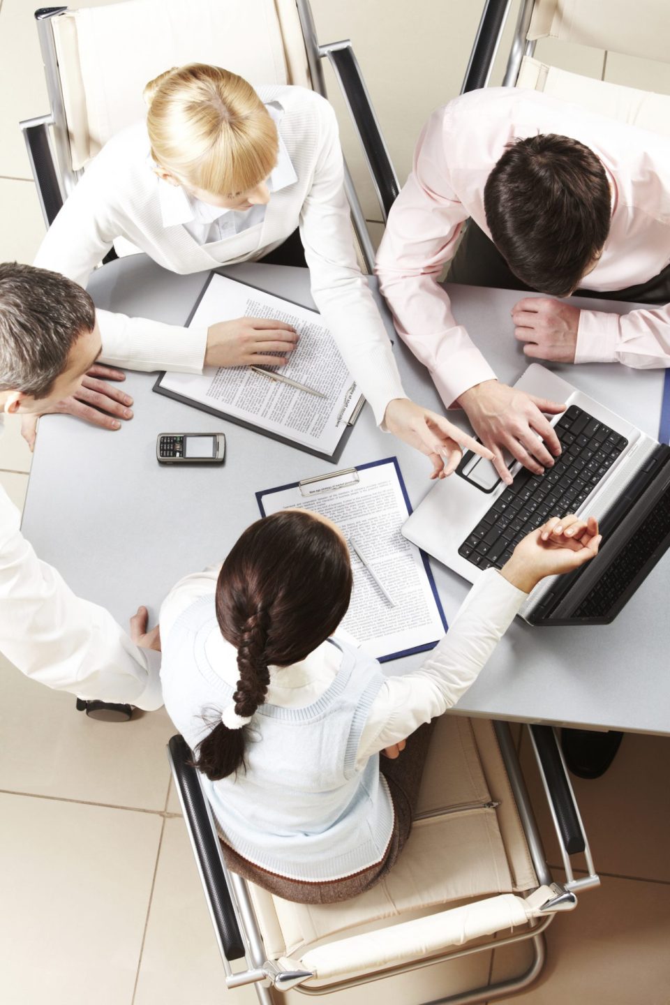 Meeting corporate birdseye view: Executives discussing strategies in a modern boardroom