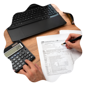 Tax preparation using a calculator and laptop to fill in a tax form return