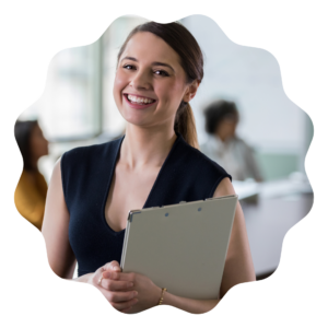 smiling woman holding a clipboard in office clothing