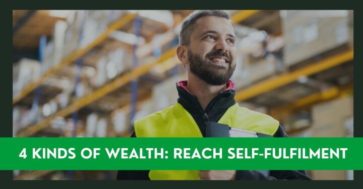 man in hi vis jacket standing in a warehouse smiling and holding a clipboard