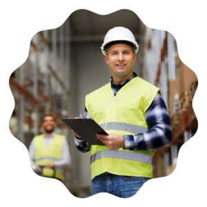 a compliance and safety officer wearing a hi vis safety vest holding a clipboard in a warehouse