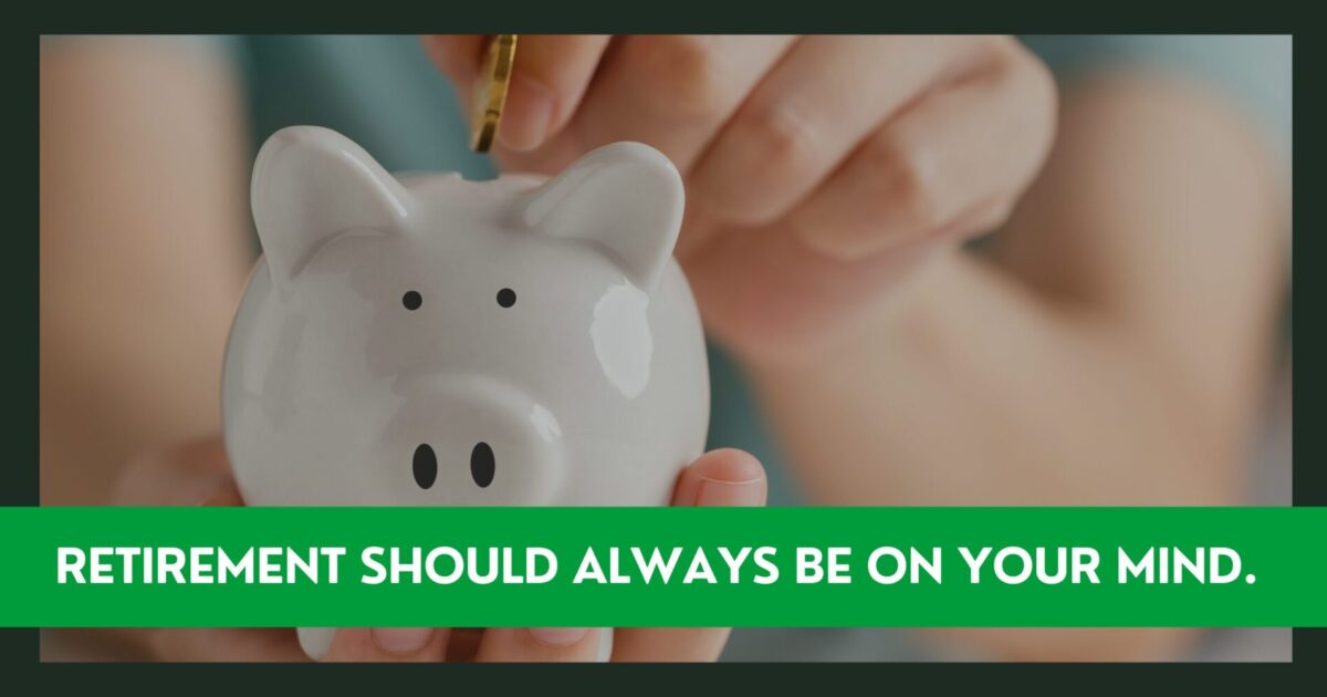 A person putting money into a piggy bank