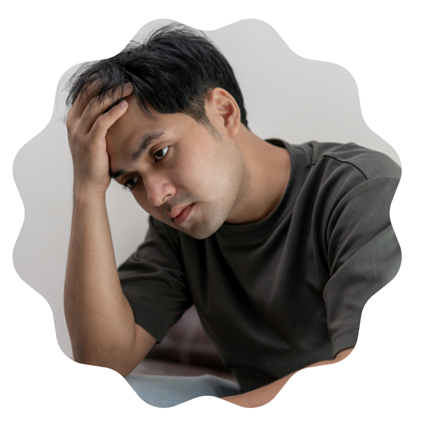 4 Things Every Aussie Should Know About Workplace Safety 5 a man wearing a grey shirt is sitting on a couch with his hand on his forehead