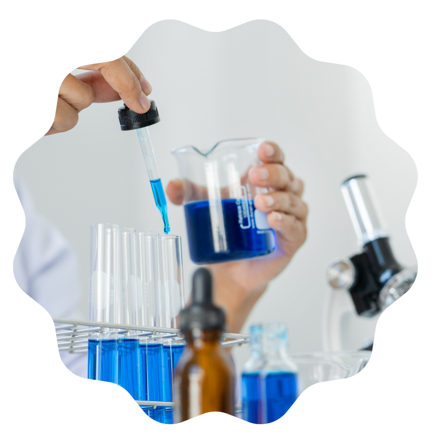 a person in a lab coat is holding a test tube with blue liquid